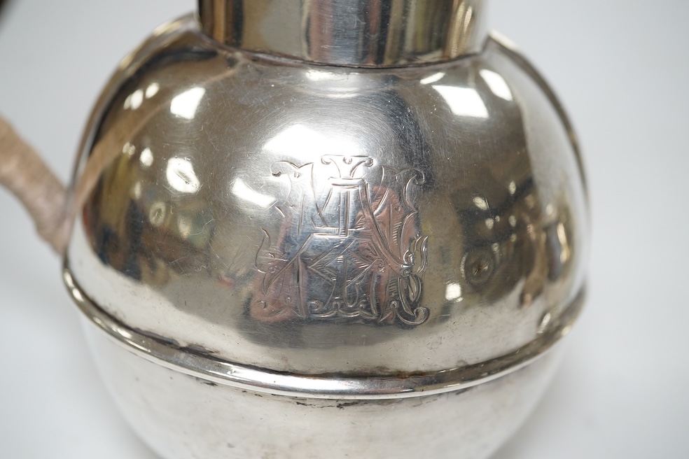 A late Victorian silver Guernsey milk can, marks rubbed, 14cm, a small silver mug and a Scottish silver kitchen pepper, Hamilton & Inches, Edinburgh, 1898, gross weight 16.4 oz. Condition - poor to fair